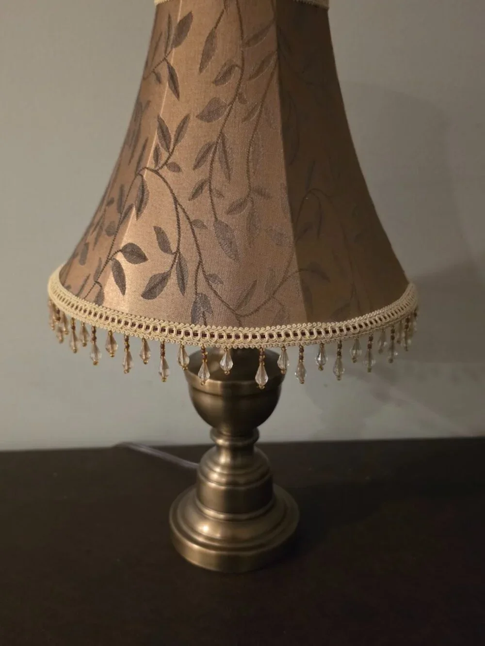 VTG Table Lamp features copper colored metal base with a fabric shade
